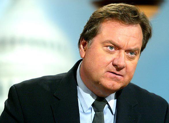 Russert asks questions on "Meet the Press" during a 2003 taping at NBC's studios in Washington, D.C.