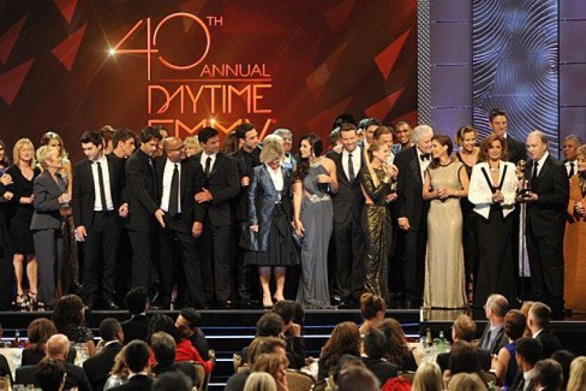 The cast and crew of "Days of Our Lives" accept the award for outstanding drama series at the 40th Daytime Emmy Awards.