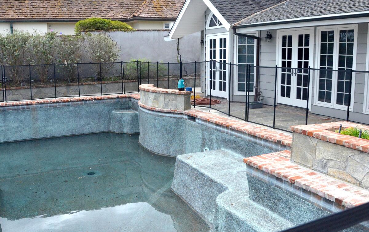 The pool suffered damage after an early morning landslide at 1472 Galaxy Drive.