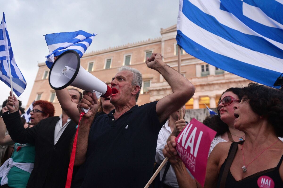 Pro-Euro demonstrators rally in front of the parliament building in Athens on Tuesday, ahead of a weekend referendum.