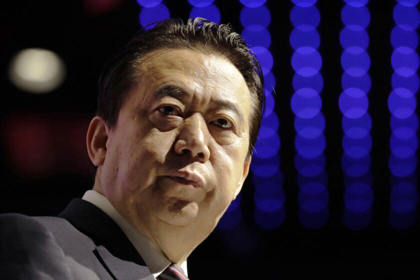 FILE - In this July 4, 2017, file photo, Interpol President Meng Hongwei delivers his opening address at the Interpol World Congress, in Singapore. China has sentenced the former president of Interpol Meng Hongwei to 13 years and six months in prison on charges of accepting bribes. (AP Photo/Wong Maye-E, File)