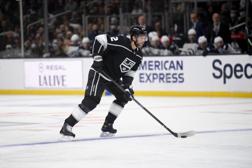 Los Angeles Kings defenseman Alexander Edler (2) controls the puck during an NHL hockey game against the Winnipeg Jets Thursday, Oct. 28, 2021, in Los Angeles. (AP Photo/Kyusung Gong)