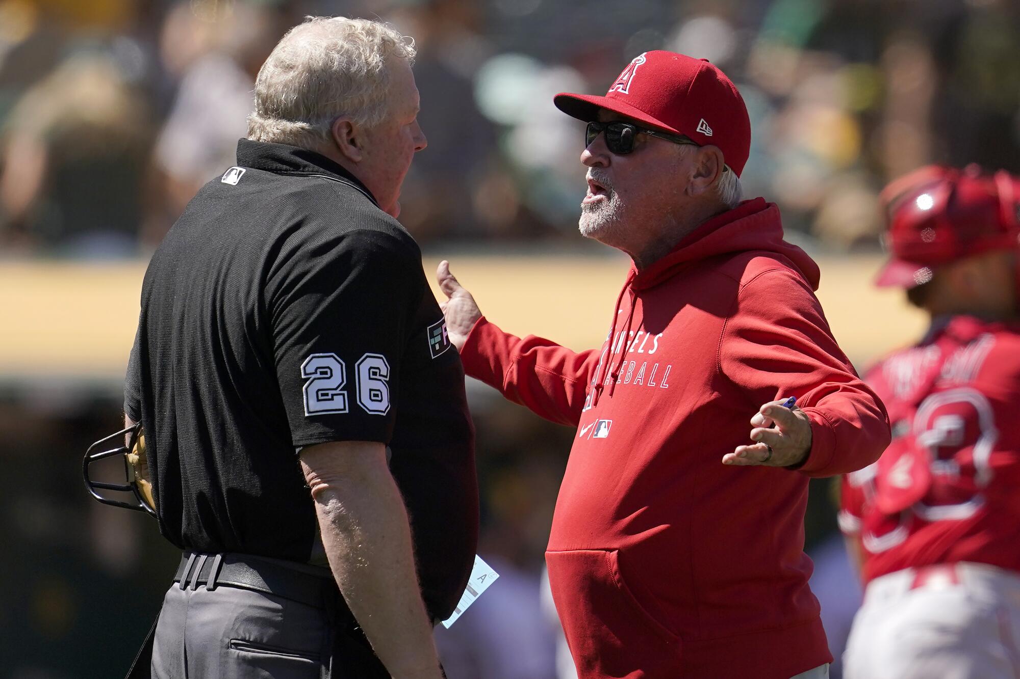 Angels manager Joe Maddon argues with home plate umpire during the Angels loss on Tuesday. (AP Photo/Jeff Chiu)