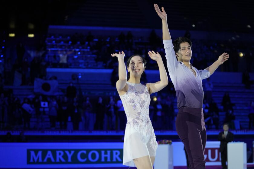 First place, Japan's Riku Miura and Ryuichi Kihara, pose after the Pairs Free Skating event during the figure skating Grand Prix finals at the Palavela ice arena, in Turin, Italy, Friday, Dec. 9, 2022. (AP Photo/Antonio Calanni)
