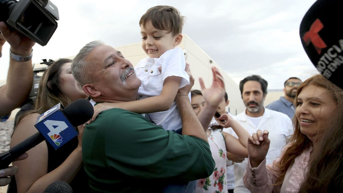 Romulo Avelica-Gonzalez embraces grandson Kelvin Cibrian, 4, after being released from the Adelanto Detention Facility.