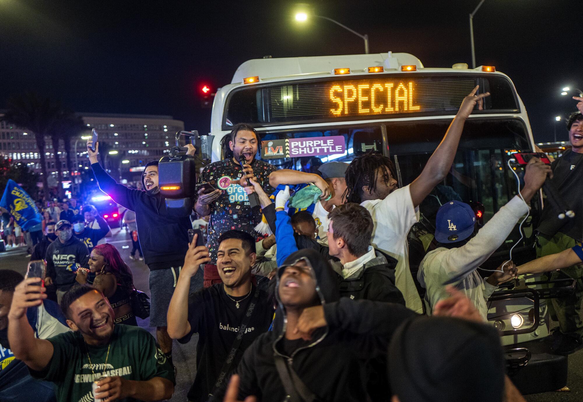 Football fans block a bus as they celebrate outside SoFi Stadium after the Los Angels Rams defeated the Cincinnati Bengals