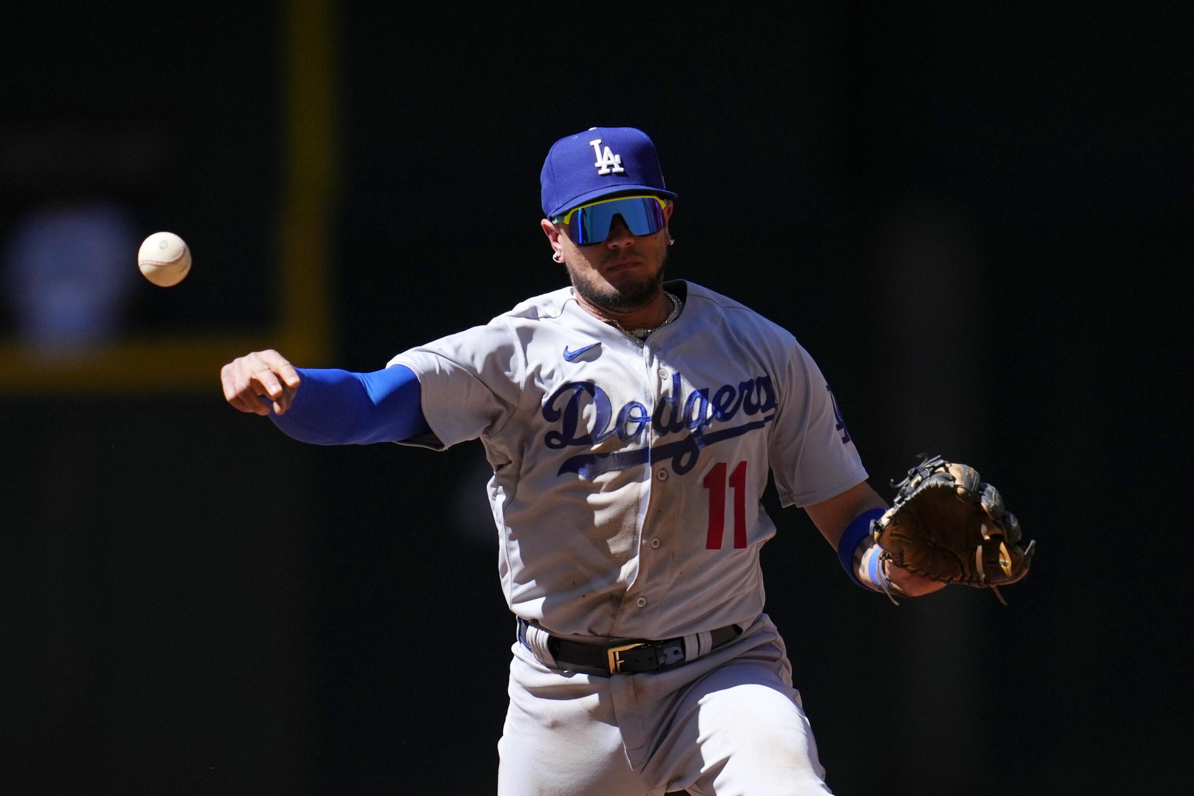 Dodgers shortstop Miguel Rojas throws to first base during a loss to the Arizona Diamondbacks.