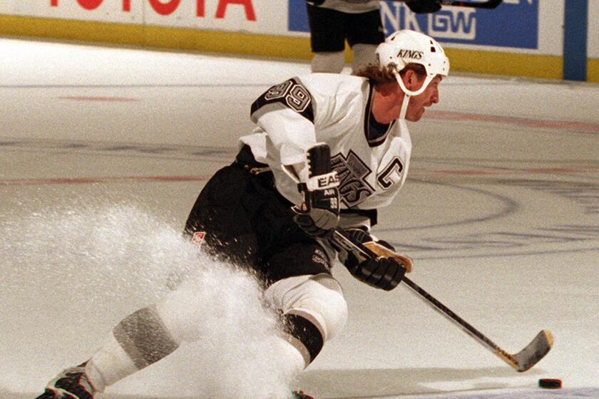 Wayne Gretzky cuts buack while skating against Vancouver at the Forum. He scored his first goal of the year in the first period.