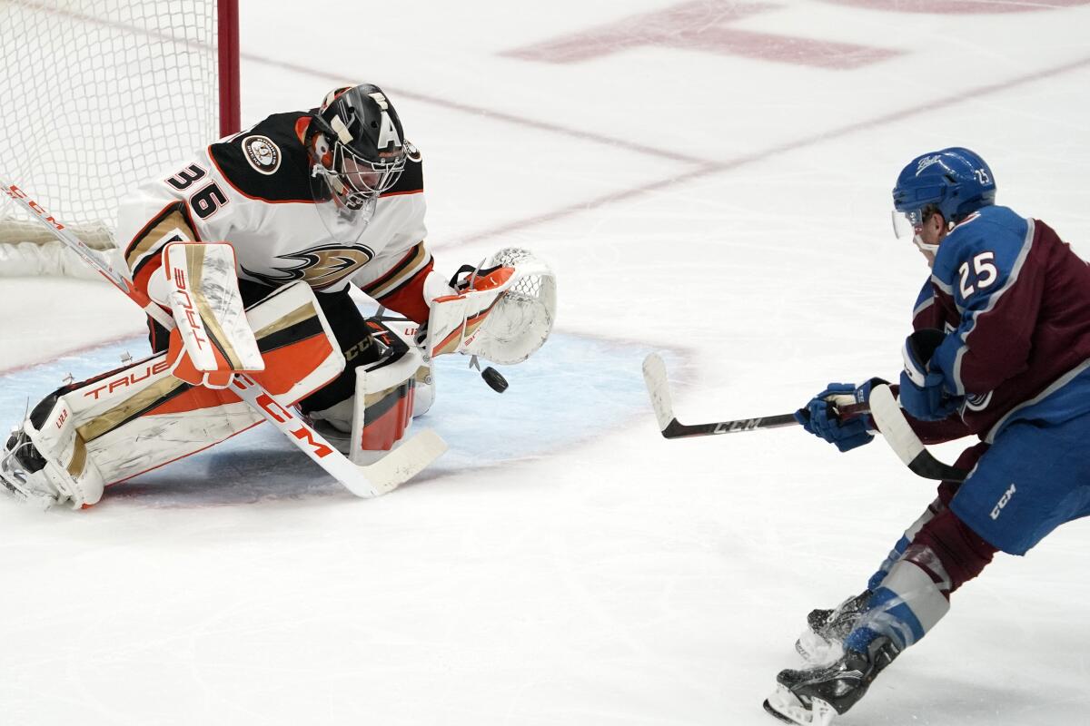 Ducks goaltender John Gibson stops a shot by Colorado Avalanche right wing Logan O'Connor.