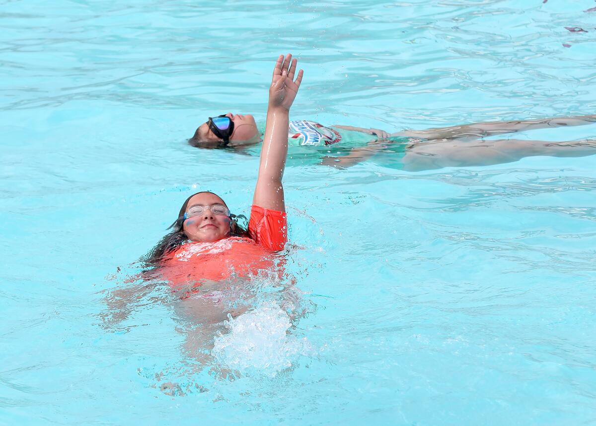 Young swimmers learn to backstroke at Wild Rivers Waterpark in Irvine.