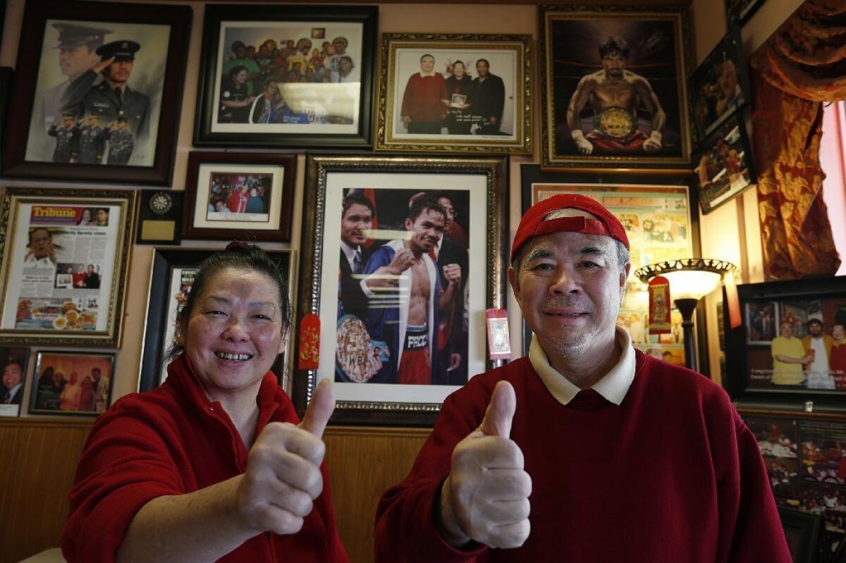 May Flower Restaurant owners Ha and Ha Lu are rooting for Filipino boxing champion Manny Pacquiao, who frequents the restaurant.