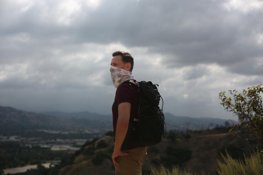 LOS ANGELES, CA - JUNE 17: Casey Schreiner, the author of an LA Times bestseller 'Discovering Griffith Park' poses for a portrait on a trail in Griffith Park on Wednesday, June 17, 2020 in Los Angeles, CA. The book is a resource for the park which holds much of the city's history within its acreage. (Dania Maxwell / Los Angeles Times)