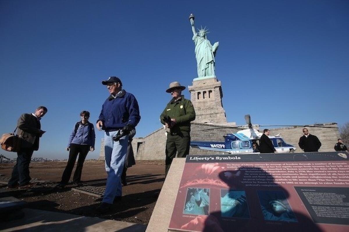 Interior Secretary Ken Salazar in December inspected damage caused by Hurricane Sandy to the grounds of the Statue of Liberty.