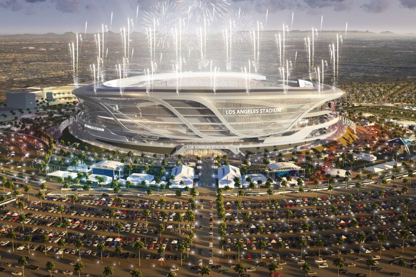 A look at the proposed $1.7-billion stadium in Carson lit up at night. It could be home to the Chargers and Raiders in the near future.