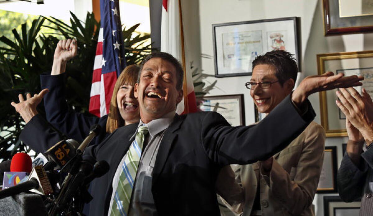 West Hollywood Councilman John Duran, center, flanked by Heid Shink from Stonewall Democrats, left, and Mayor Abbe Land celebrate the U.S. Supreme Court's decision to strike down a key part of the federal Defense of Marriage Act and overturning of California's Proposition 8. at a news conference held at City Hall.