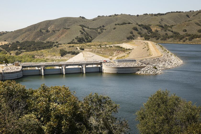 SANTA BARBARA, CA - MAY 20: The Bradbury Dam finished in 1953 across the Santa Ynez River forms Cachuma Lake, North of Santa Barbara, on May 20, 2020 which is over 80% full thanks to two good Southern California rainy seasons in a row. The 2020 rainy season helped the water supply in Southern California but it has played out very differently across the state: Parts of Northern California are experiencing the driest season on record, while the state's southeast corner is among the wettest on record. Cachuma Lake on Wednesday, May 20, 2020 in Santa Barbara, CA. (Al Seib / Los Angeles Times)
