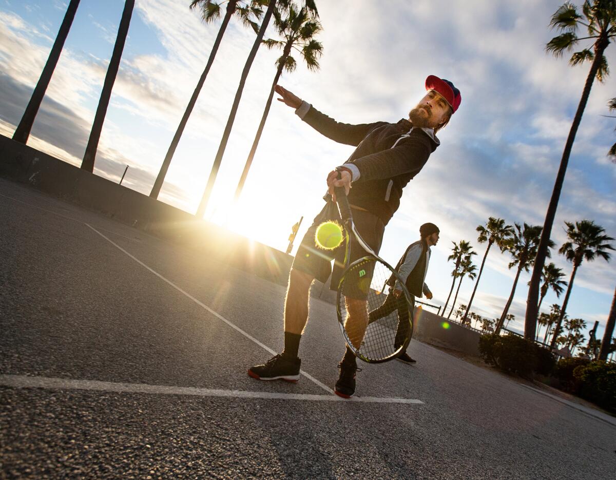 Tanner Wells, 41, practices tennis on the courts at Venice Beach on Thursday.