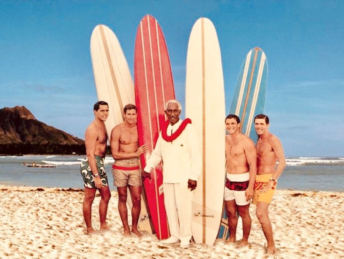 Duke Kahanamoku (center) stands in front of the four charter members of his hand-selected surf team. 