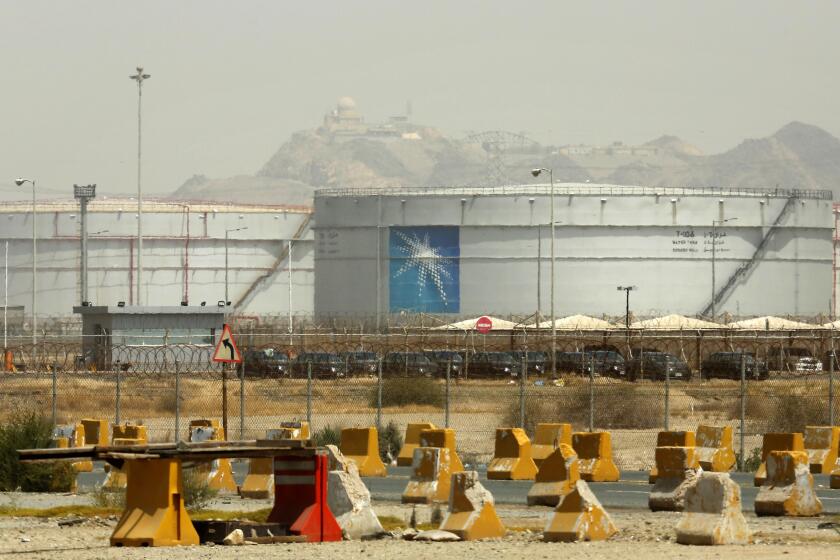 FILE - Storage tanks are seen at the North Jeddah bulk plant, an Aramco oil facility, in Jeddah, Saudi Arabia, on March 21, 2021. Saudi Arabia said Friday, May 31, 2024, it will sell a second sliver of stock in its state oil giant Aramco worth billions of dollars, its first tranche since its initial public offering back in 2019. (AP Photo/Amr Nabil, File)