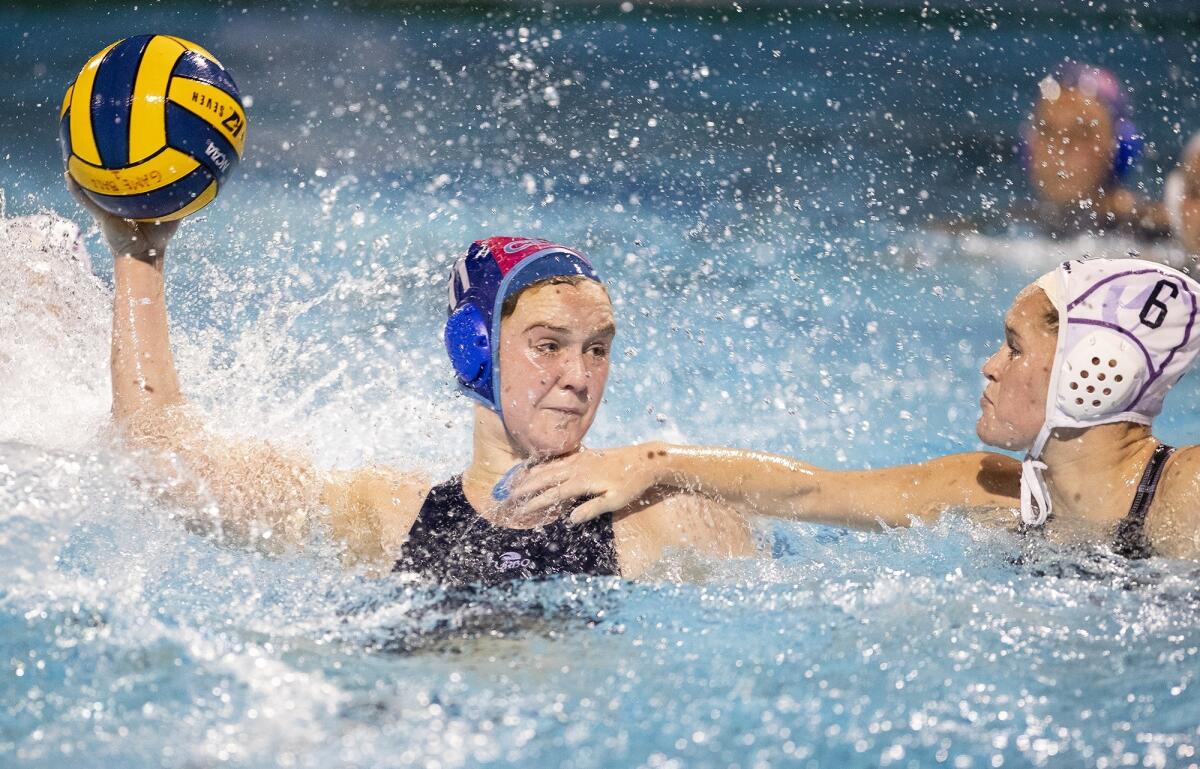 Corona del Mar's Sophie Wallace takes a shot against Carlsbad's Fiona Schmidt in the first round of the CIF Southern California Regional Division I playoffs on Feb. 22 at Segerstrom High.