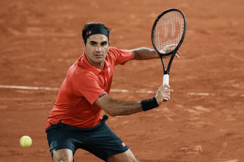 Switzerland's Roger Federer plays a return to Germany's Dominik Koepfer during their third round match on day 7, of the French Open tennis tournament at Roland Garros in Paris, France, Saturday, June 5, 2021. (AP Photo/Thibault Camus)