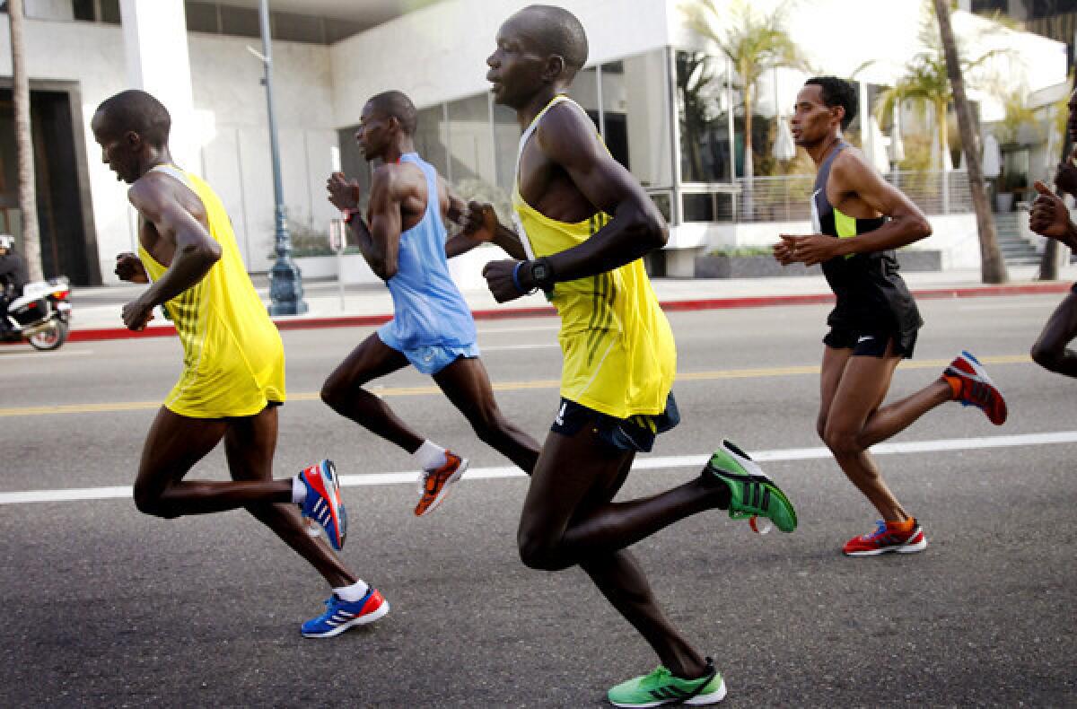 Erick Mose (green shoes) is part of the men's elite group before breaking away for the 2013 L.A. Marathon victory.