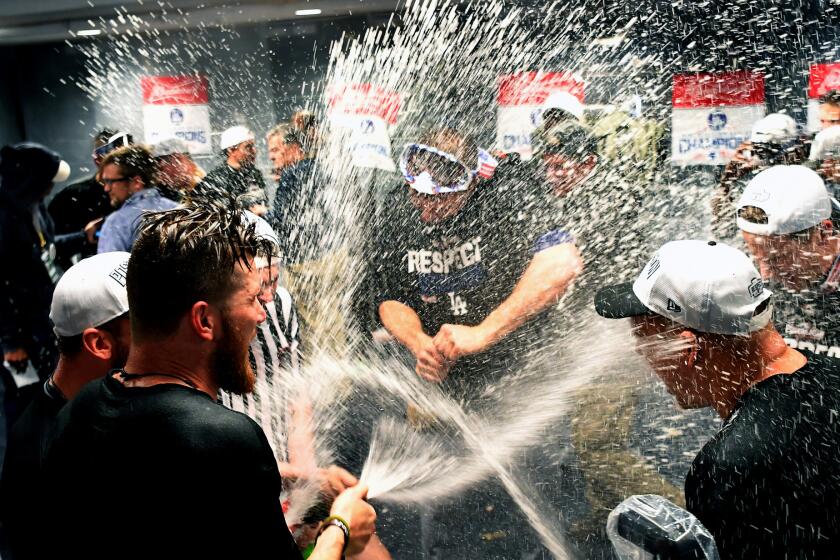 WASHINGTON D.C., OCTOBER 13, 2016-Dodgers players celebrate in the locker room after defeating the Nationals in Game 5 of the NLDS in Washington D.C. Thursday. (Wally Skalij/Los Angeles Times)