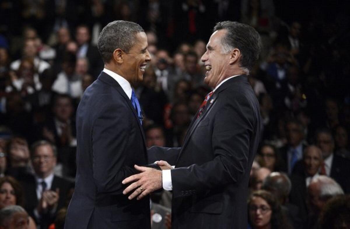 President Obama and Republican presidential nominee Mitt Romney laugh at the conclusion of the third presidential debate at Lynn University in Boca Raton, Fla.