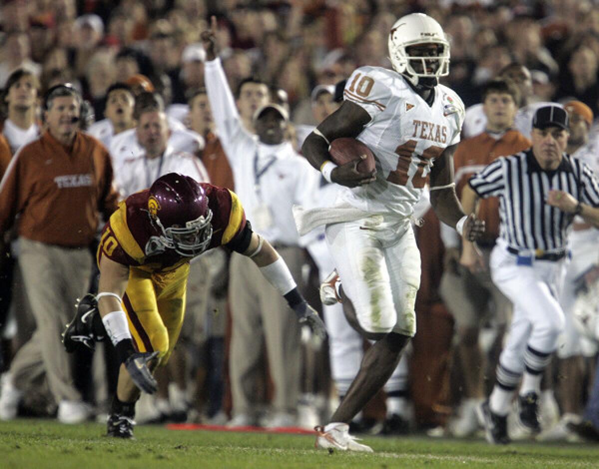 Texas quarterback Vince Young breaks off a big run during the third quarter of the Longhorns' comeback victory over USC in the 2006 BCS championship game at the Rose Bowl. Young later scored the winning touchdown.