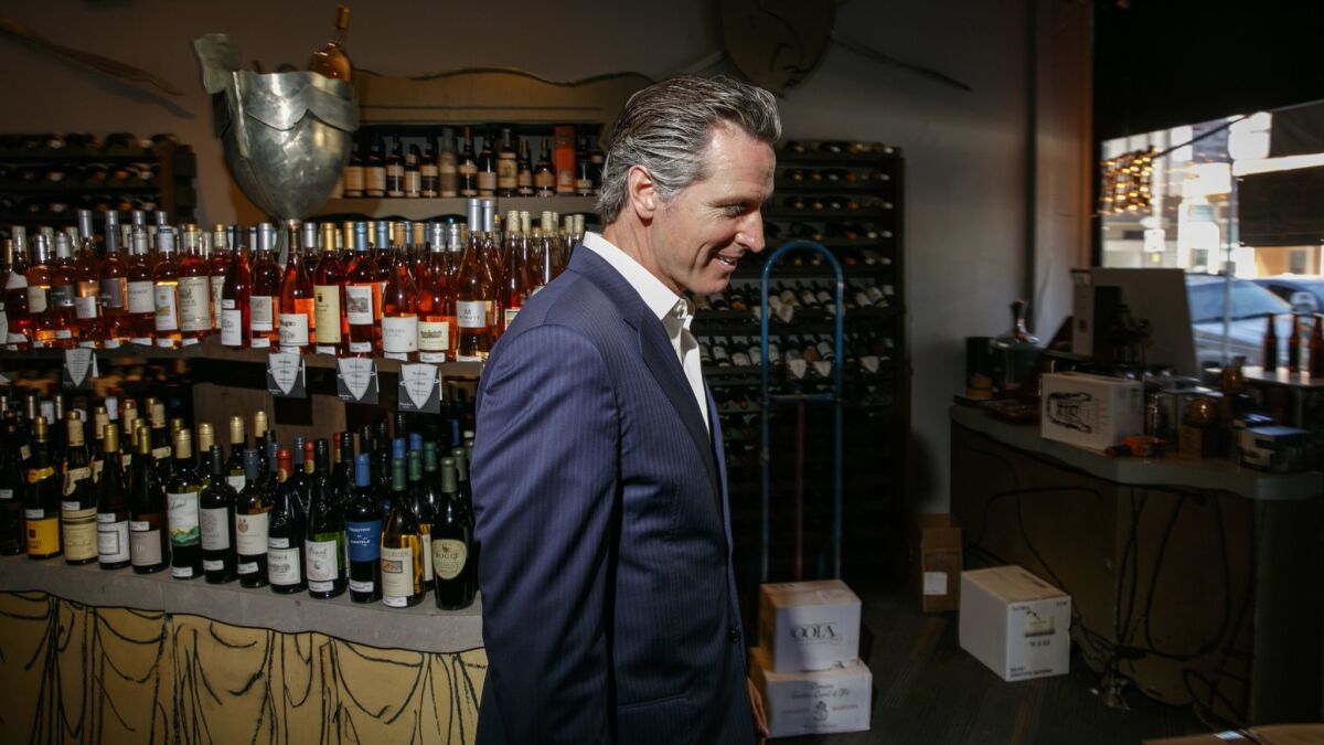 Gavin Newsom visits PlumpJack Wines and Spirits, a store he opened in 1992 in the Marina District of San Francisco.