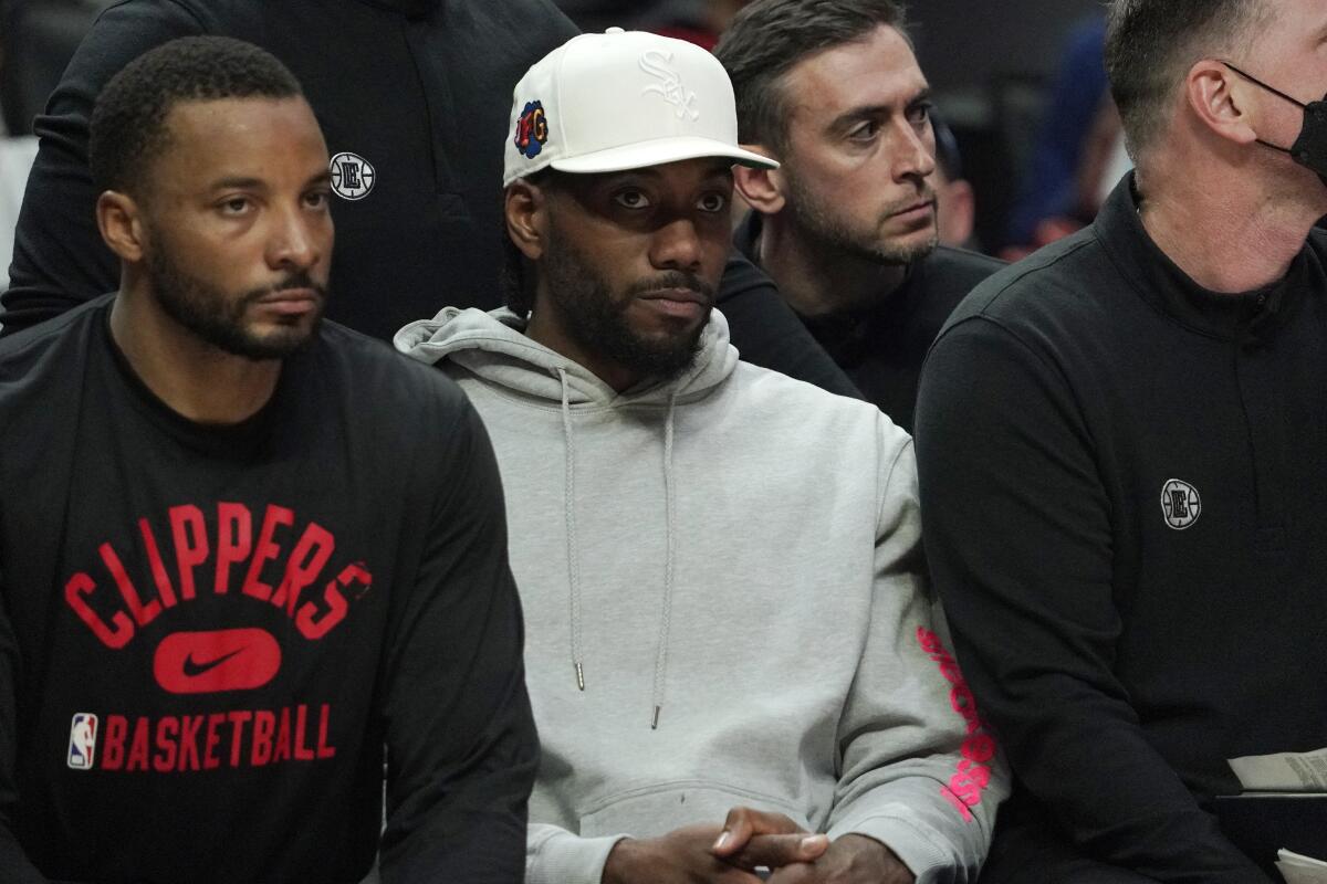 Clippers' Kawhi Leonard sits on the bench.