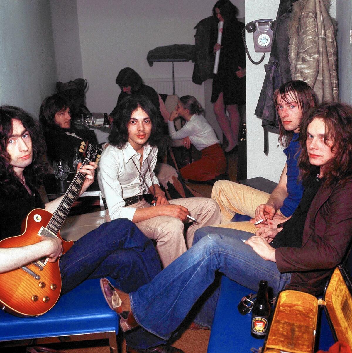 Members of the British blues-rock band Free gather backstage in 1972. From left are singer Paul Rodgers, bassist Andy Fraser, drummer Simon Kirke and guitarist Paul Kossoff.
