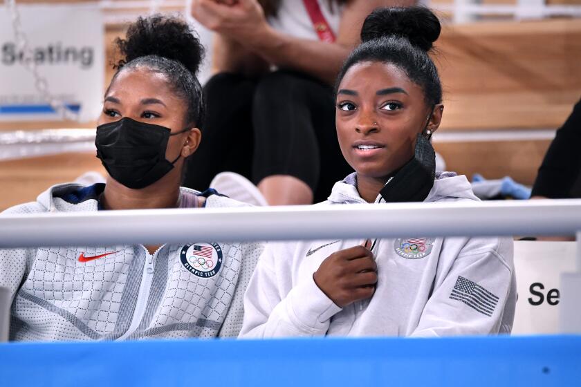 -TOKYO,JAPAN July 29, 2021: USA's Simone Biles, right and Jordan Chiles watch the women's individual all-around final from the seats at the 2020 Tokyo Olympics. (Wally Skalij /Los Angeles Times)
