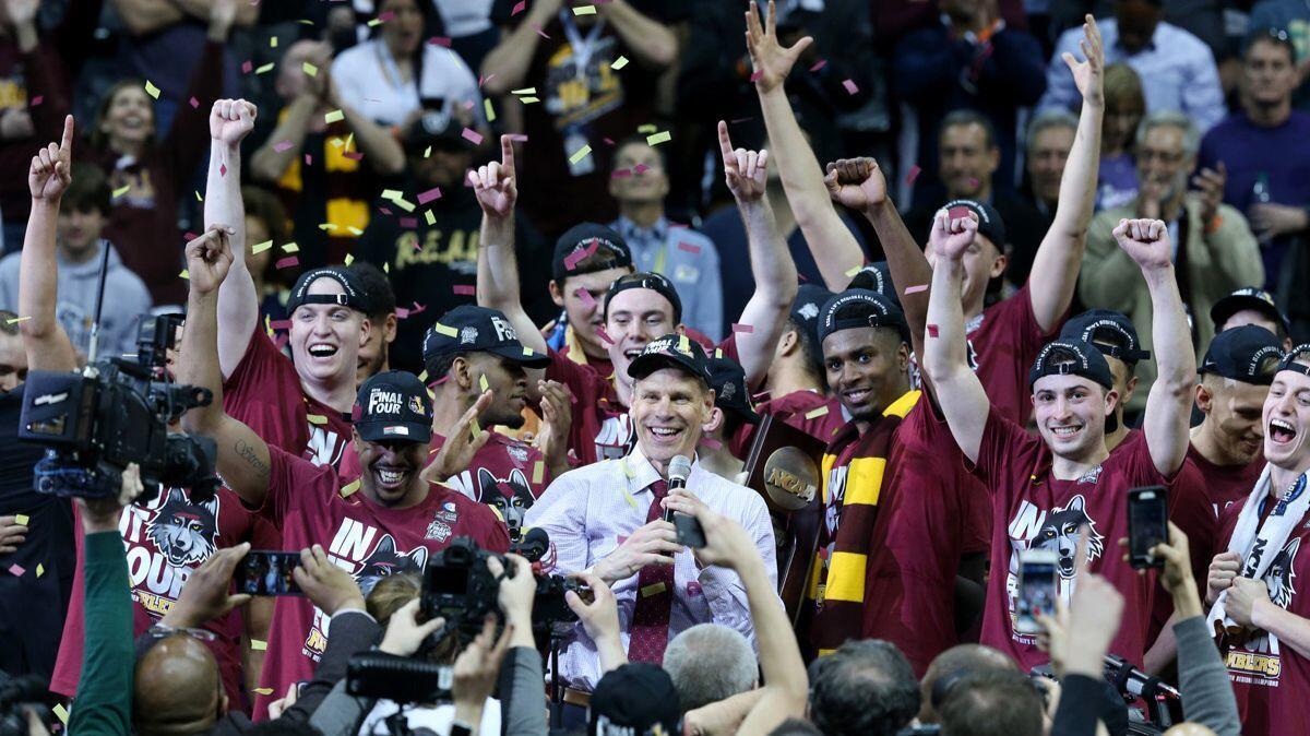 Loyola head coach Porter Moser addresses fans as the team celebrates after a 78-62 win against Kansas State in an NCAA tournament regional final in Atlanta on Saturday.