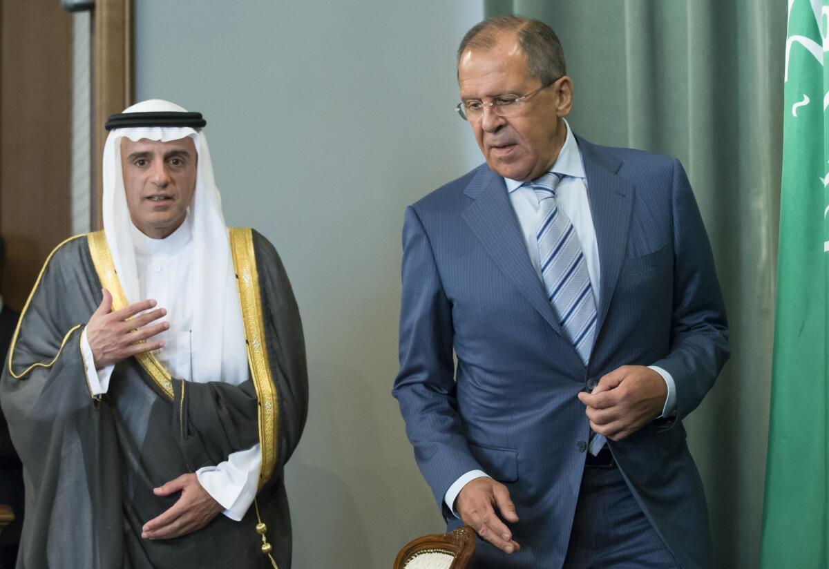 Russian Foreign Minister Sergei Lavrov, right, and Saudi counterpart Adel Jubeir arrive at a news conference after their meeting in Moscow on Aug. 11, 2015.