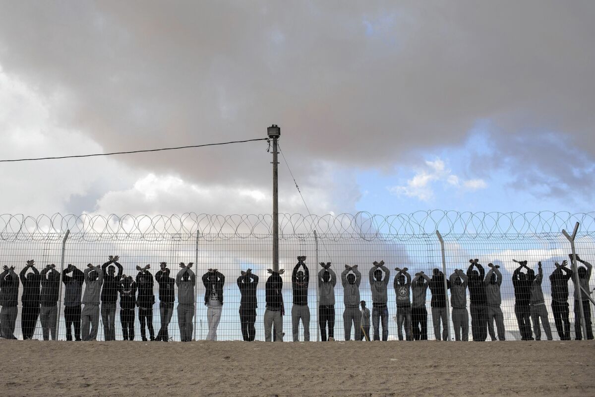 Inmates protest at the Holot immigrant detention center in the Negev desert last month. A law passed last year allows officials to indefinitely hold people who entered the country without permission.