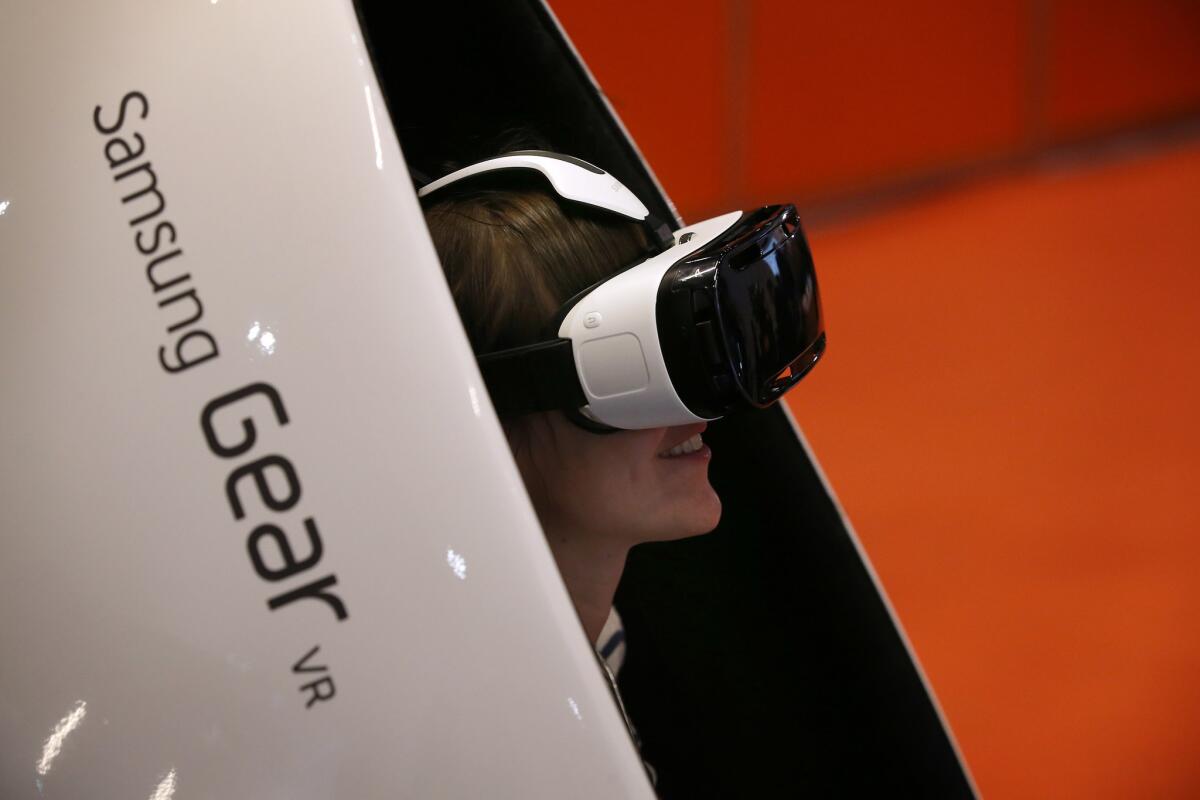 A person wears the Samsung Gear VR headset at the Wearable Technology Show in London in March.