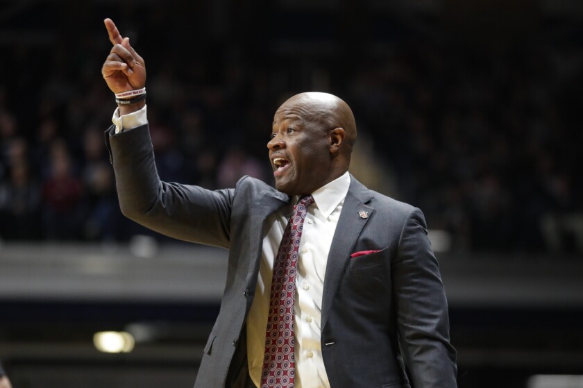 FILE - St. John's coach Mike Anderson gestures during the first half of the team's NCAA college basketball game against Butler in Indianapolis, in this Wednesday, March 4, 2020, file photo. Big East Conference coach of the year Mike Anderson of St. John's has been given a new six-year contract through at least the 2026-27 season. The university announced the deal on Thursday, May 13, 2021, after seeing Anderson deliver consecutive winning seasons in his first two years. (AP Photo/Michael Conroy, File)