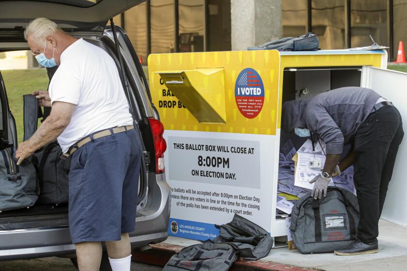 NORWALK, CA - NOVEMBER 04: Los Angeles County Registrar collect ballots from drop box located at Los Angeles County Registrar on Wednesday, Nov. 4, 2020 in Norwalk, CA. (Irfan Khan / Los Angeles Times)