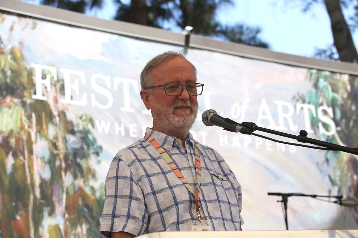 David Perry, president of the Festival of Arts, addresses the crowd during the 90th anniversary celebration on Saturday.