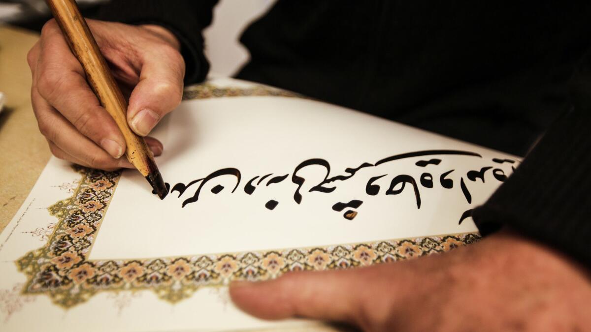 Masud Valipour demonstrates his calligraphy.
