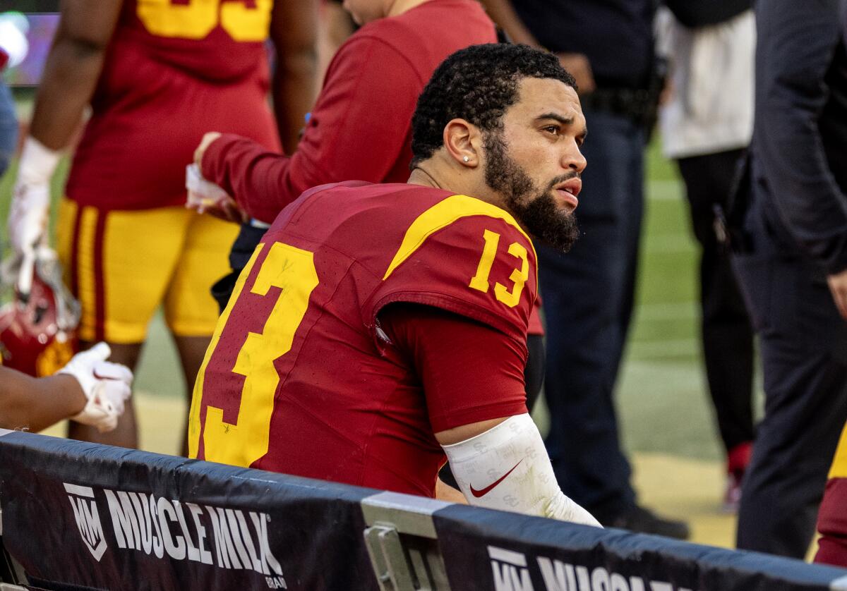 USC quarterback Caleb Williams sits on the bench during the final moments of a 38-20 loss to UCLA on Saturday.