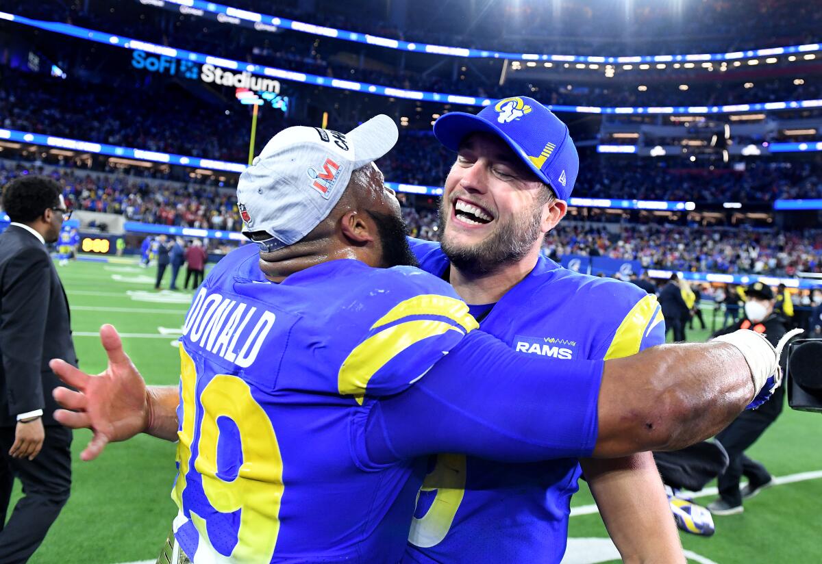 Rams defensive lineman Aaron Donald, left, celebrates with quarterback Matthew Stafford.