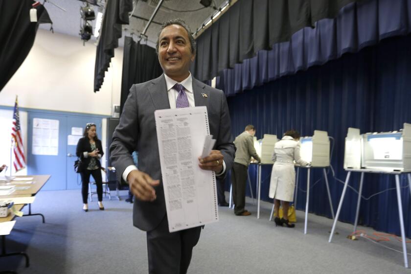 Rep. Ami Bera (D-Elk Grove), who just won an extremely close race with Republican Doug Ose, prepares to cast his ballot on election day.