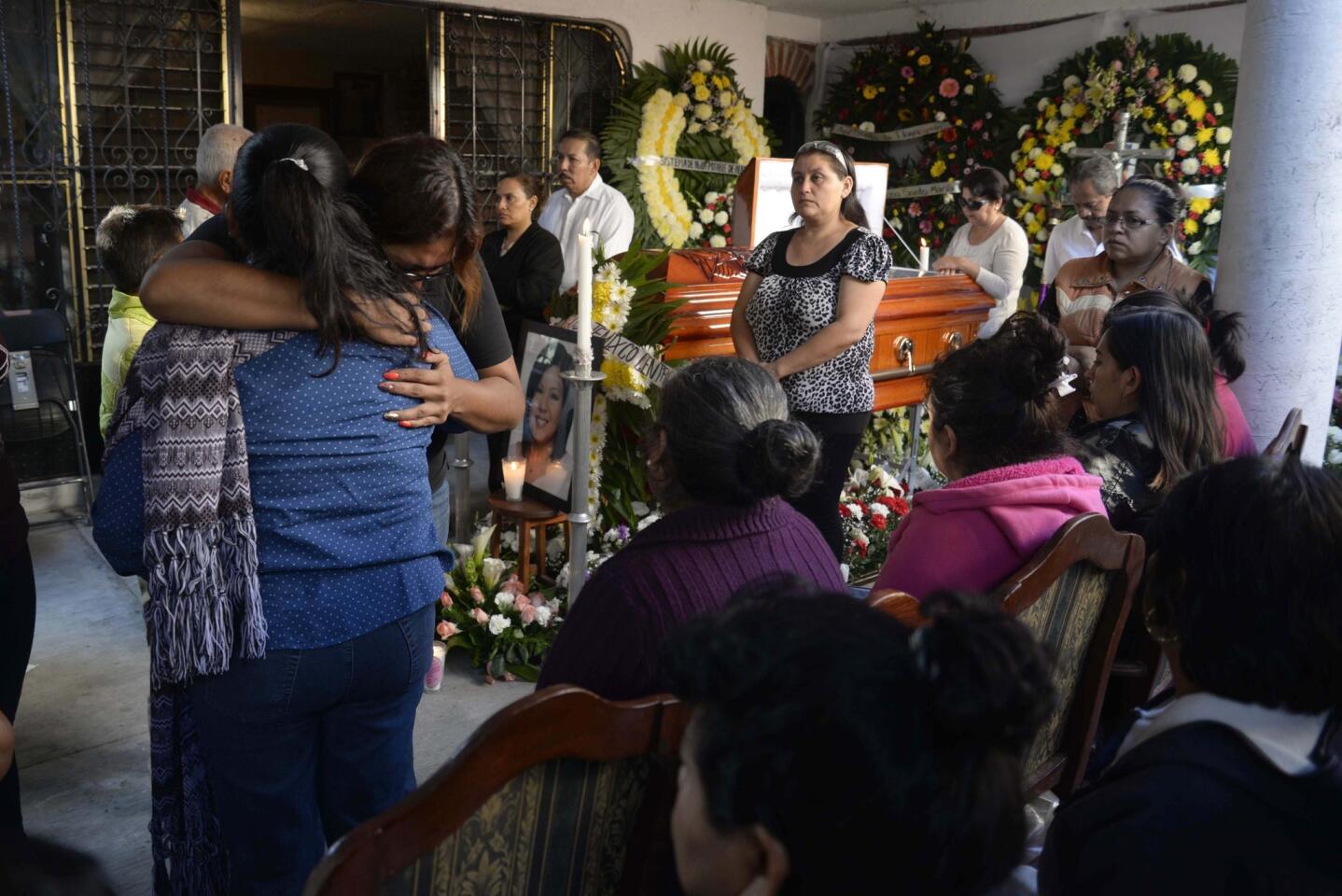Family members mourn during the wake of the slain mayor of Temixco, Gisela Mota, at her home in Temixco, Mexico, Sunday, Jan. 3. (AP Photo/Tony Rivera)