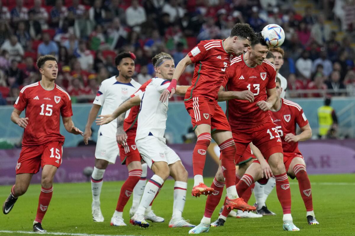 Wales' Kieffer Moore, right, heads the ball during the second half against the U.S.