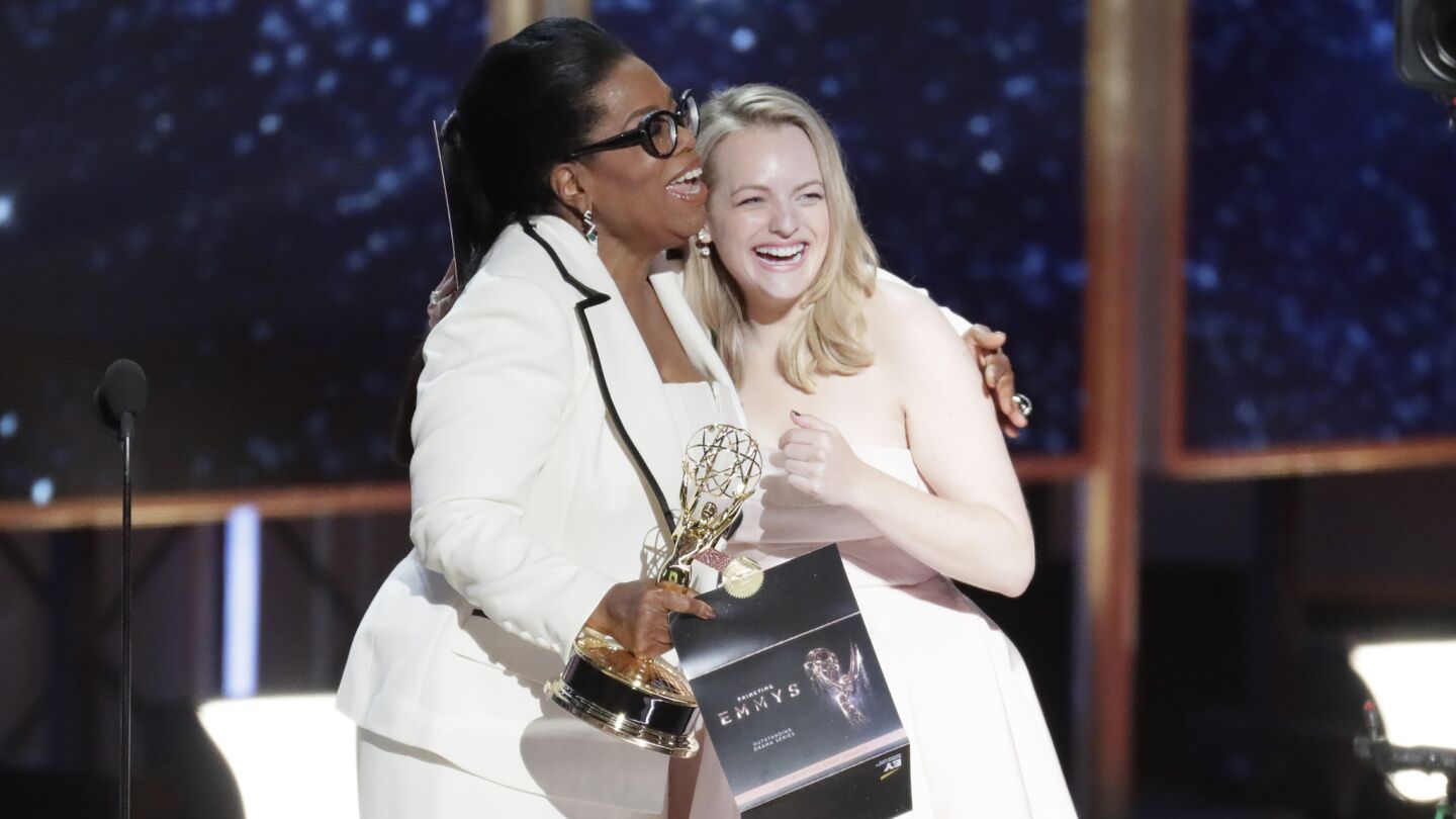 Presenter Oprah Winfrey and Emmy winner Elisabeth Moss of "The Handmaid's Tale" after the show won the Emmy for drama series.