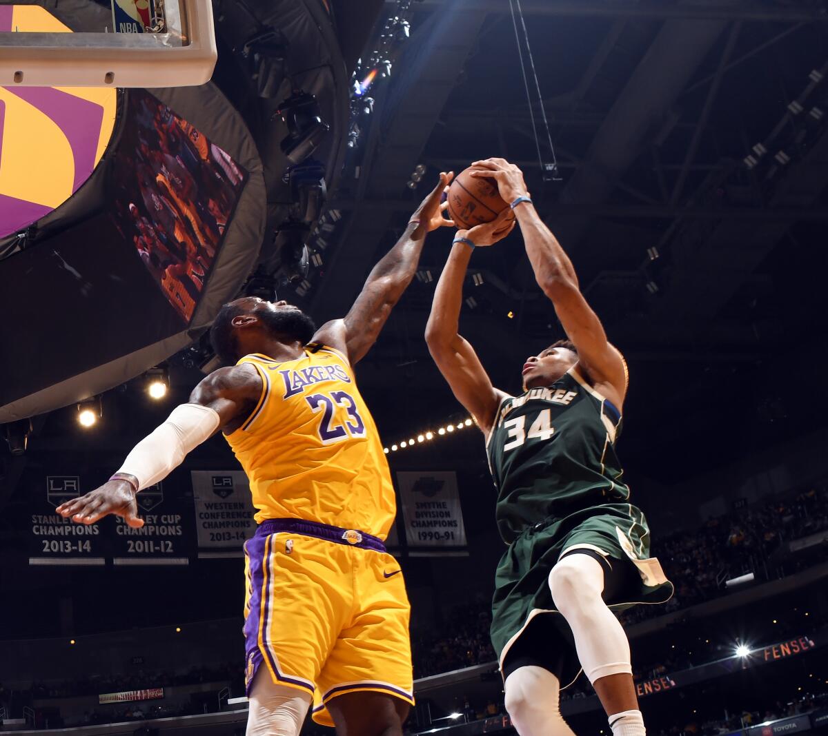 Lakers' LeBron James attempts to block a shot by Milwaukee Bucks' Giannis Antetokounmpo on March 6 at Staples Center.