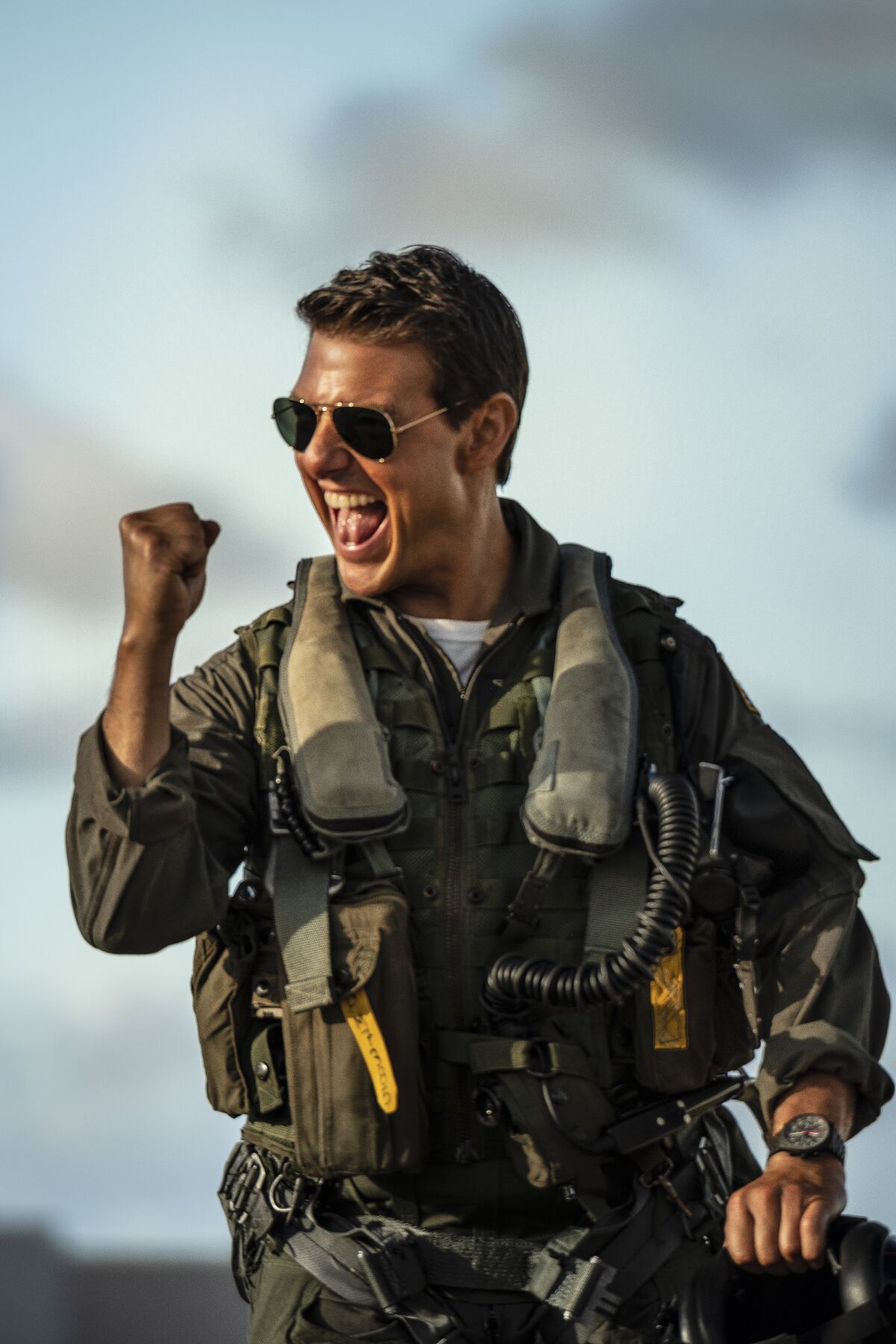 Tom Cruise raises a fist in celebration in a scene from "Top Gun: Maverick"