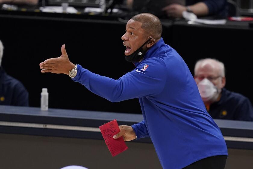 Philadelphia 76ers head coach Doc Rivers shouts during the first half of an NBA basketball game against the Indiana Pacers, Friday, Dec. 18, 2020, in Indianapolis. (AP Photo/Darron Cummings)
